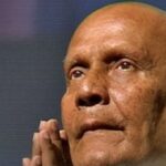 Se Šrí Činmojem na ramenou